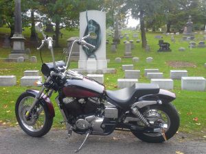 Goth bike photographed in cemetery