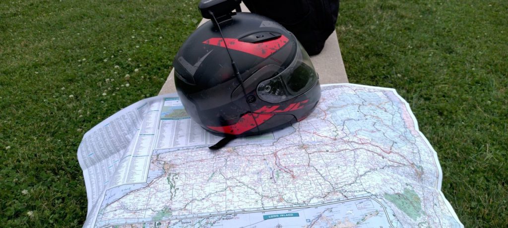 A map and motorcycle helmet.